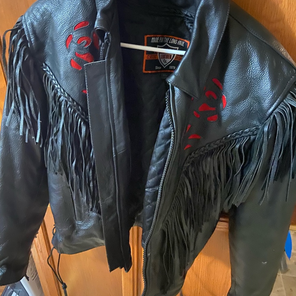 Barley worn leather jacket with rose detail